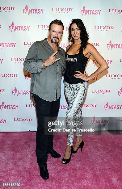 Troy Burgess and Yesi arrive at the FANTASY calendar launch at the Luxor Hotel and Casino on October 22, 2013 in Las Vegas, Nevada.