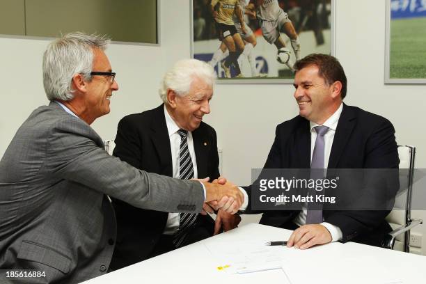 Ange Postecoglou shakes hands with FFA CEO David Gallop and FFA Chairman Frank Lowy before a press conference at the FFA Headquarters on October 23,...