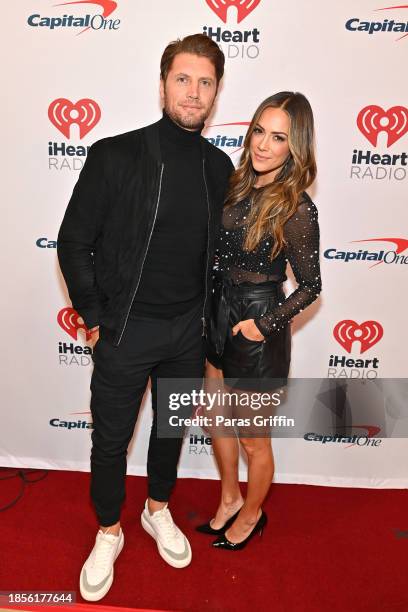 Allan Russell and Jana Kramer attend iHeartRadio Power 96.1's Jingle Ball 2023 at State Farm Arena on December 14, 2023 in Atlanta, Georgia.