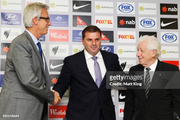 Ange Postecoglou shakes hands with FFA CEO David Gallop and FFA Chairman Frank Lowy during a press conference at the FFA Headquarters on October 23,...