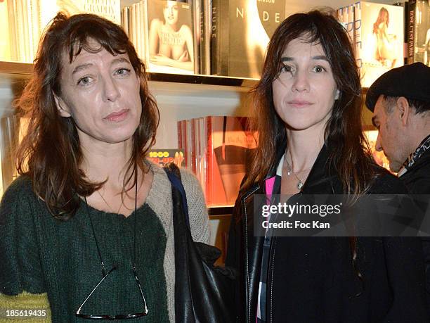 Kate Barry and Charlotte Gainsbourg attend the 'Jane Et Serge A Family Album' : Book Signing At Taschen Odeon on October 22, 2013 in Paris, France.