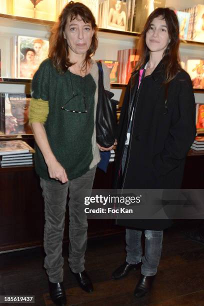 Kate Barry and Charlotte Gainsbourg attend the 'Jane Et Serge A Family Album' : Book Signing At Taschen Odeon on October 22, 2013 in Paris, France.