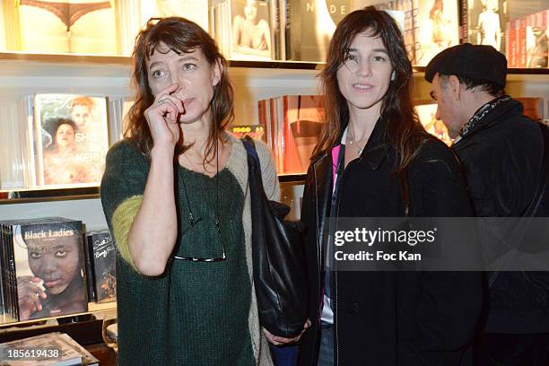 Kate Barry and Charlotte Gainsbourg attend the 'Jane Et Serge A Family Album' : Book Signing At Taschen Odeon on October 22, 2013 in Paris, France.