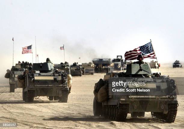 Army 11th Engineers attached to the 3-7 infantry move into position March 18, 2003 ahead of a possible military strike near the Kuwait-Iraq border....
