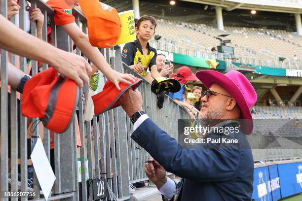 Commentator Matthew Hayden signs autographs during day two of the Men's First Test match between Australia and Pakistan at Optus Stadium on December...