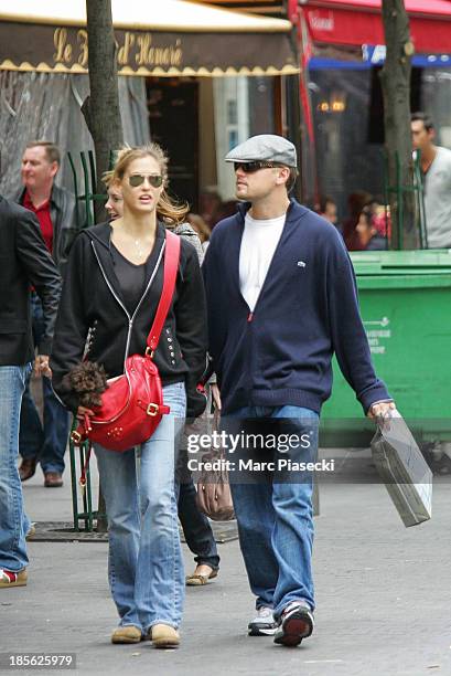 Actor Leonardo Di Caprio and girlfriend Bar Refaeli are seen strolling on 'Place du Marche Saint-Honore' on October 21, 2006 in Paris, France.