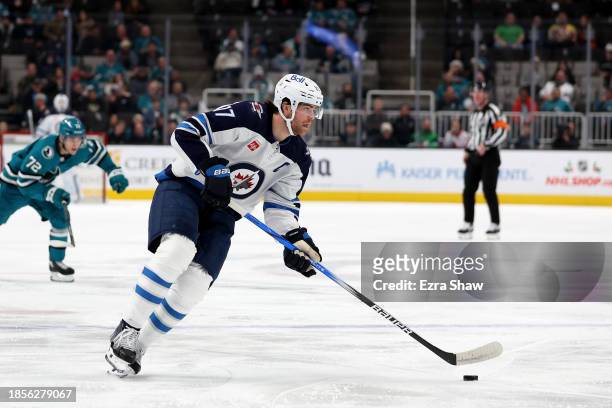Adam Lowry of the Winnipeg Jets in action against the San Jose Sharks at SAP Center on December 12, 2023 in San Jose, California.