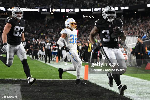 Running back Brandon Bolden of the Las Vegas Raiders rushes for a touchdown against the Los Angeles Chargers during the second quarter at Allegiant...