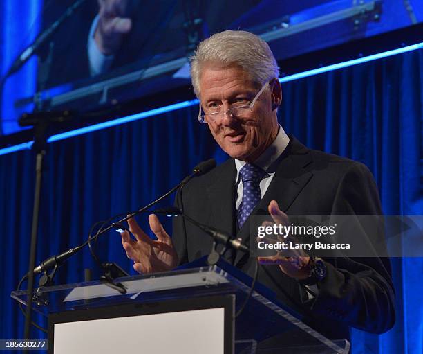 President Bill Clinton speaks on stage at the T.J. Martell Foundation's 38th Annual Honors Gala at Cipriani 42nd Street on October 22, 2013 in New...