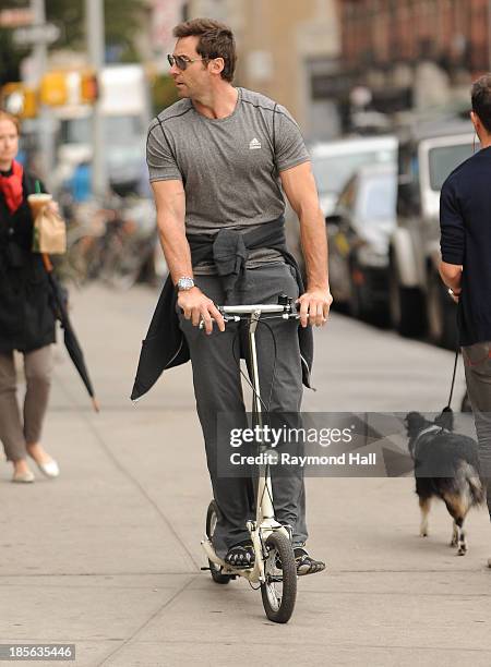 Actor Hugh Jackman is seen riding a scooter in the West Village on October 23, 2013 in New York City.