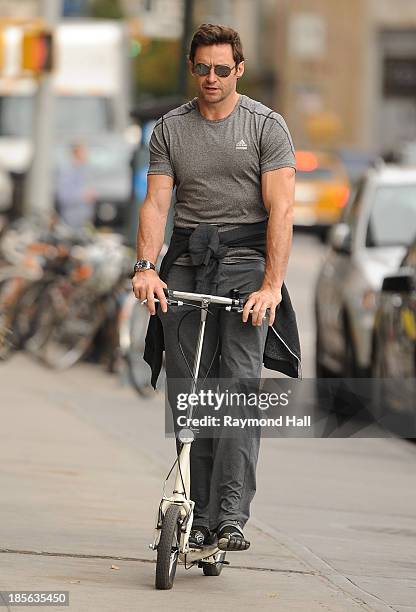 Actor Hugh Jackman is seen riding a scooter in the West Village on October 23, 2013 in New York City.