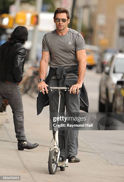 Actor Hugh Jackman is seen riding a scooter in the West Village on October 23, 2013 in New York City.