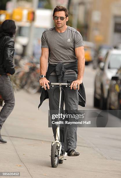 Actor Hugh Jackman is seen riding a scooter in the West Village on October 23, 2013 in New York City.