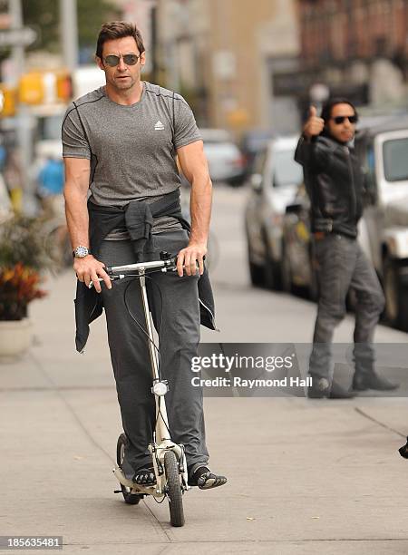 Actor Hugh Jackman is seen riding a scooter in the West Village on October 23, 2013 in New York City.