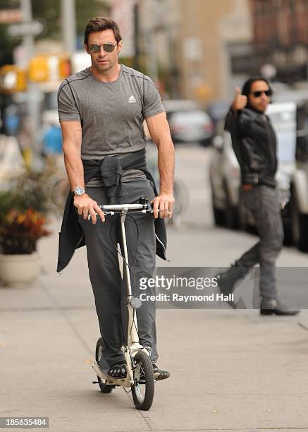 Actor Hugh Jackman is seen riding a scooter in the West Village on October 23, 2013 in New York City.