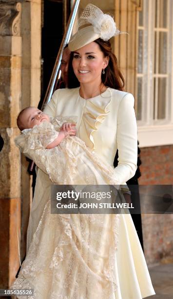 Catherine, Duchess of Cambridge, holds her son Prince George of Cambridge following his Christening at Chapel Royal in St James's Palace in central...