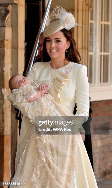 Catherine, Duchess of Cambridge carries her son Prince George Of Cambridge after his christening at the Chapel Royal in St James's Palace on October...