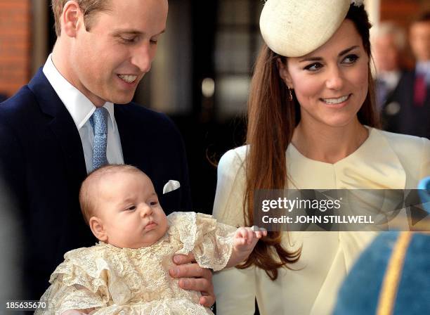 Britain's Prince William, Duke of Cambridge and his wife Catherine, Duchess of Cambridge, arrive with their son Prince George of Cambridge at Chapel...