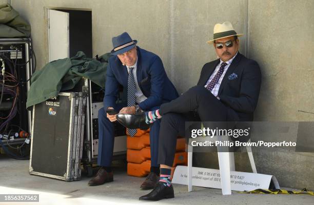 Michael Vaughan and Ravi Shastri working for Fox Sports wait in some shade before day two of the Men's First Test match between Australia and...