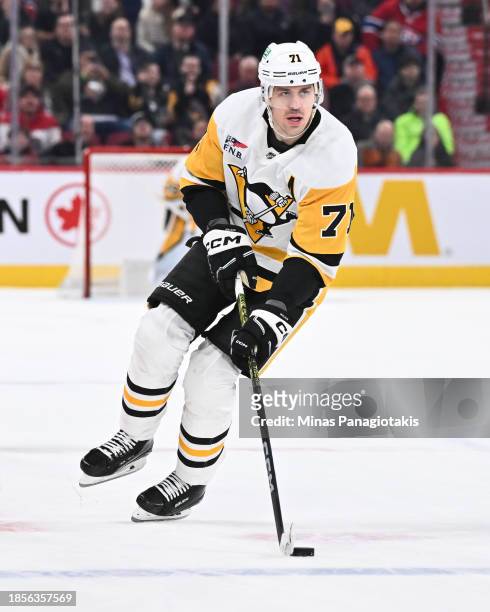 Evgeni Malkin of the Pittsburgh Penguins skates the puck during the shootout against the Montreal Canadiens at the Bell Centre on December 13, 2023...