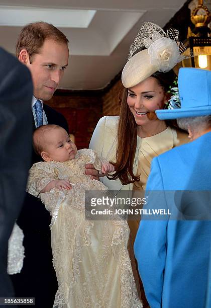 Queen Elizabeth II speaks with Britain's Prince William, Duke of Cambridge and his wife Catherine, Duchess of Cambridge, as they arrive with their...