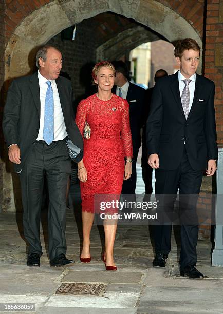 Michael and Julia Samuel arrive with one of Prince George's godparents Hugh Grosvenor at the Chapel Royal in St James's Palace, ahead of the...