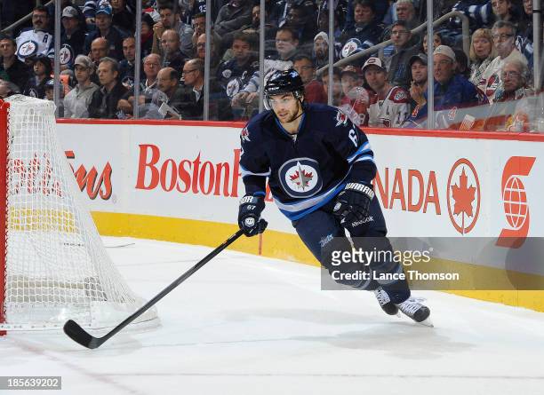 Michael Frolik of the Winnipeg Jets follows the play around the net during first period action against the Montreal Canadiens at the MTS Centre on...