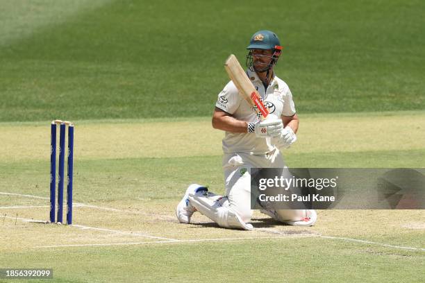 Mitchell Marsh of Australia falls to his knees during day two of the Men's First Test match between Australia and Pakistan at Optus Stadium on...