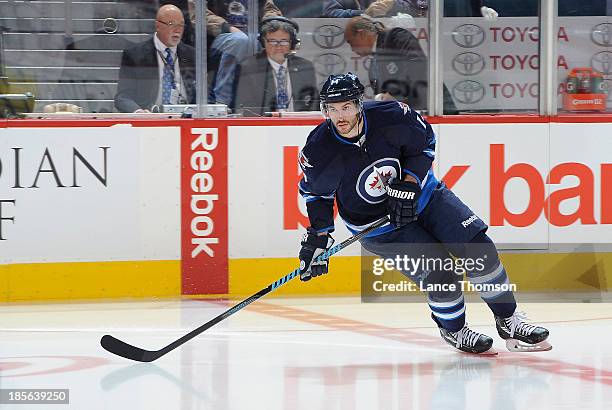 Anthony Peluso of the Winnipeg Jets takes part in the pre-game warm up prior to NHL action against the Montreal Canadiens at the MTS Centre on...