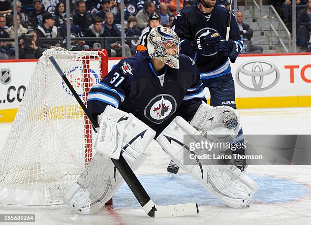 Goaltender Ondrej Pavelec of the Winnipeg Jets keeps an eye on the play during third period action against the Montreal Canadiens at the MTS Centre...