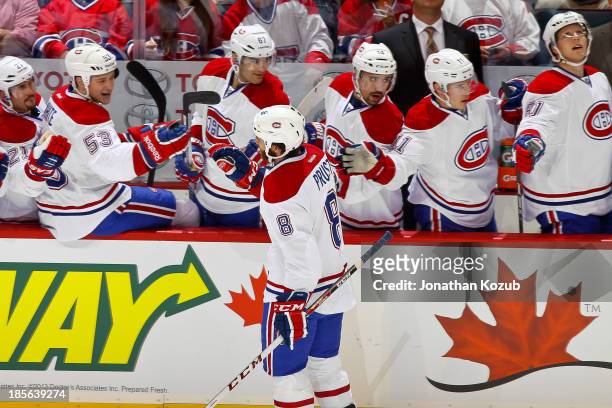 Brandon Prust of the Montreal Canadiens celebrates a first period goal against the Winnipeg Jets with teammates at the bench at the MTS Centre on...