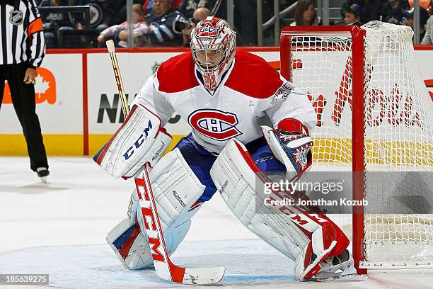 Goaltender Carey Price of the Montreal Canadiens keeps an eye on the play during third period action against the Winnipeg Jets at the MTS Centre on...