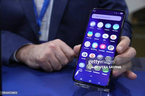 The presentation of the Russian smartphone R-Fon running by the domestic Linux-based Rosa Mobile operating system in Moscow on December 18, 2023. The...