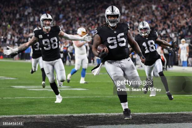 Defensive tackle John Jenkins of the Las Vegas Raiders scores a touchdown against the Los Angeles Chargers during the third quarter at Allegiant...