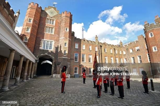 The St James's Palace detachment of The Queen's Guard turns out in Colour Court, St James Palace, for the arrival of Britain's Queen Elizabeth II,...