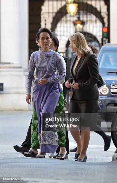 Myanmar's opposition leader Aung San Suu Kyi arrives to meet Britain's Prime Minister David Cameron accompanied by Secretary of State for...