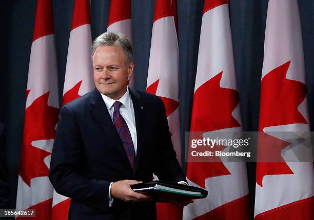 Stephen Poloz, governor of the Bank of Canada, arrives at a news conference in Ottawa, Ontario, Canada, on Wednesday, Oct. 23, 2013. Poloz surprised...