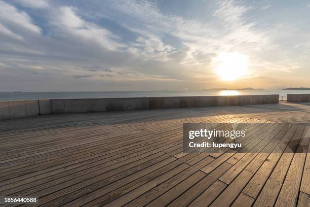 empty seaside street at sunset - empty street stock pictures, royalty-free photos & images