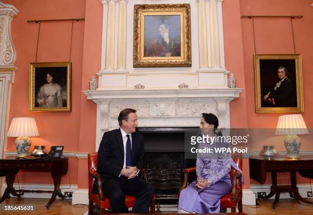 Myanmar's opposition leader Aung San Suu Kyi meets with Britain's Prime Minister David Cameron at 10 Downing Street on October 23, 2013 in London,...