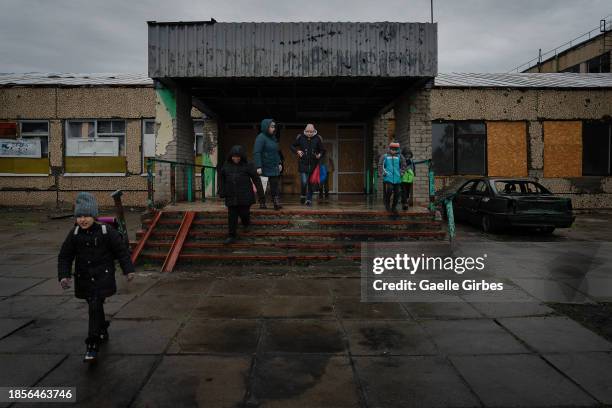 Children walk out of a school building on December 14, 2023 in Vysokopillya, Ukraine. Both Russia and Ukraine's authorities deny targeting civilians...
