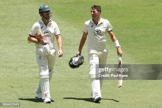 Mitchell Marsh and Pat Cummins of Australia leave the field at the break during day two of the Men's First Test match between Australia and Pakistan...