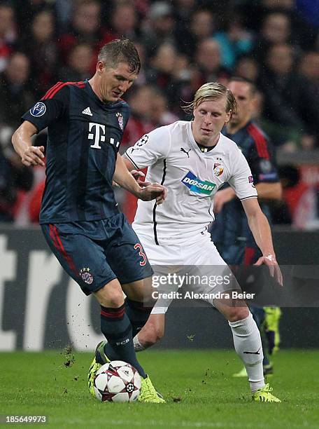 Bastian Schweinsteiger of Bayern Muenchen and Frantisek Rajtoral of Viktoria Plzen compete for the ball during the UEFA Champions League group D...