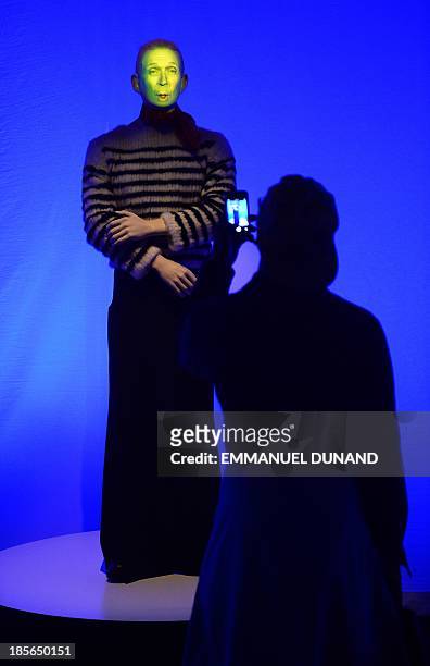 Video-animated life-size mannequin of French fashion designer Jean Paul Gaultier greets visitors during a press preview of "The Fashion World of Jean...