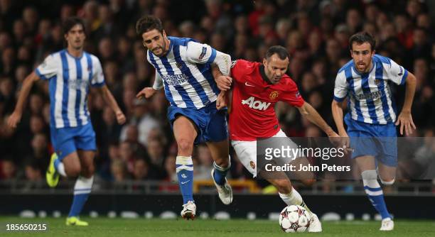 Ryan Giggs of Manchester United in action with Markel Bergara of Real Sociedad during the UEFA Champions League Group A match between Manchester...