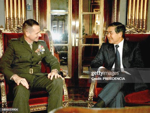 The head of the US Southern Command Gen. Peter Pace talks with Peruvian Presdiente Alberto Fujimori druing a meeting at the Government Palace in...