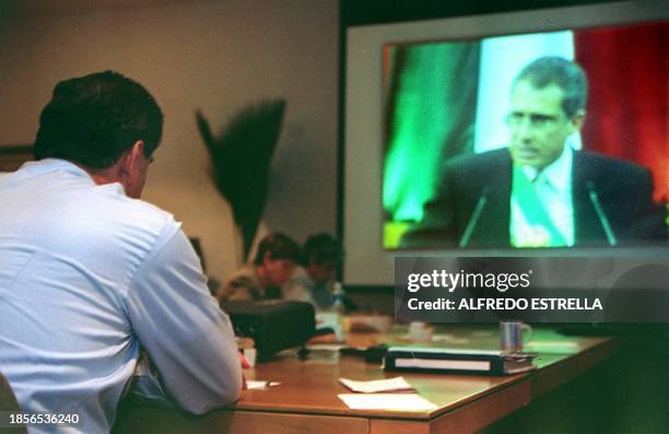 Mexican President-Elect Vicente Fox, watches as Mexican President Ernesto Zedillo gives his annual state of the union address, in Mexico City, 01...