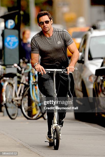 Actor Hugh Jackman is seen riding a scooter in the West Village on October 23, 2013 in New York City.