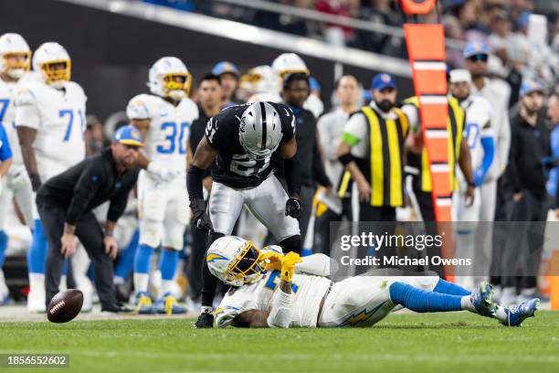 Amik Robertson of the Las Vegas Raiders reacts to Brian Hoyer of the Las Vegas Raiders during an NFL football game between the Las Vegas Raiders and...