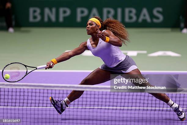 Serena Williams of the United States returns a ball at the net to Agnieszka Radwanska of Poland during day two of the TEB BNP Paribas WTA...