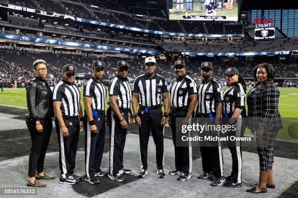 Officials pose for a group photo prior to an NFL football game between the Las Vegas Raiders and the Los Angeles Chargers at Allegiant Stadium on...